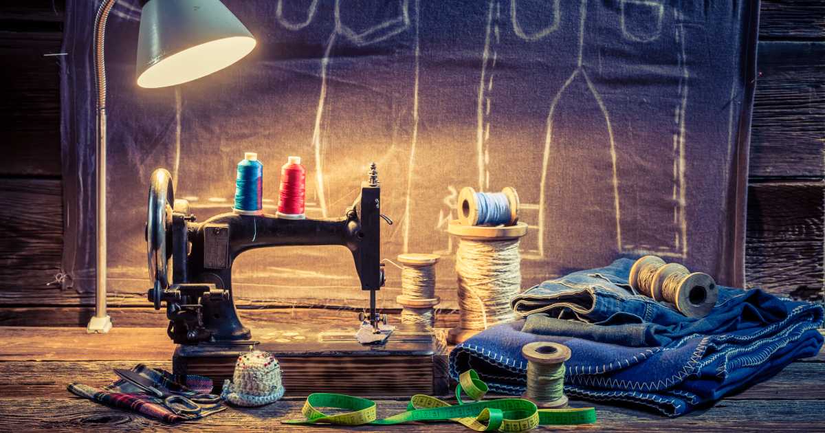 fashion and apparel industry | tailor workshop with sewing machine cloth and scissors